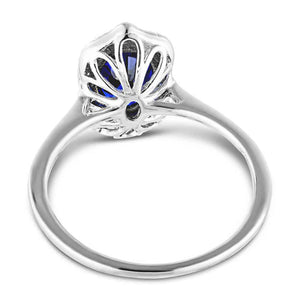 Antique style ring with blue sapphire in white gold shown from back