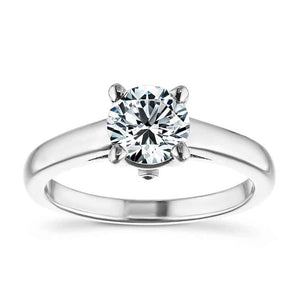 Traditional solitaire engagement ring with hidden diamonds and a 1ct round cut lab created diamond set in 14k recycled white gold