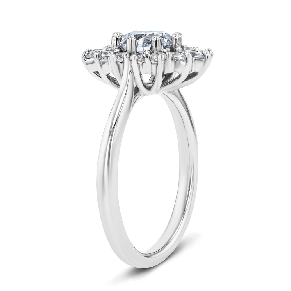 Shown here with a 1.0ct Round Cut Lab Grown Diamond center stone in 14K White Gold|shown with a 1 carat lab grown diamond center stone with a lab grown diamond floral inspired halo set in 14k white gold metal