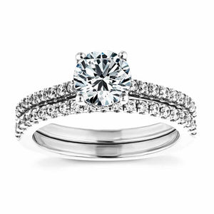 Lab created diamond hidden halo accented engagement ring with matching wedding band