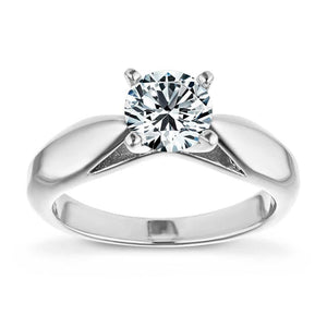 Modern solitaire engagement ring with wide band and cathedral style design featuring 1ct round cut lab grown diamond in platinum shown from front