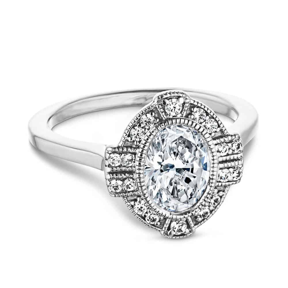 Shown with 1ct Oval Cut Lab Grown Diamond in 14k White Gold|Antique style engagement ring with milgrain detail diamond accented halo surrounding a 1ct oval cut lab grown diamond in 14k white gold