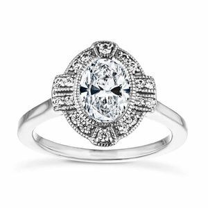 Vintage style engagement ring with milgrain detail diamond accented halo surrounding a 1ct oval cut lab grown diamond in 14k white gold