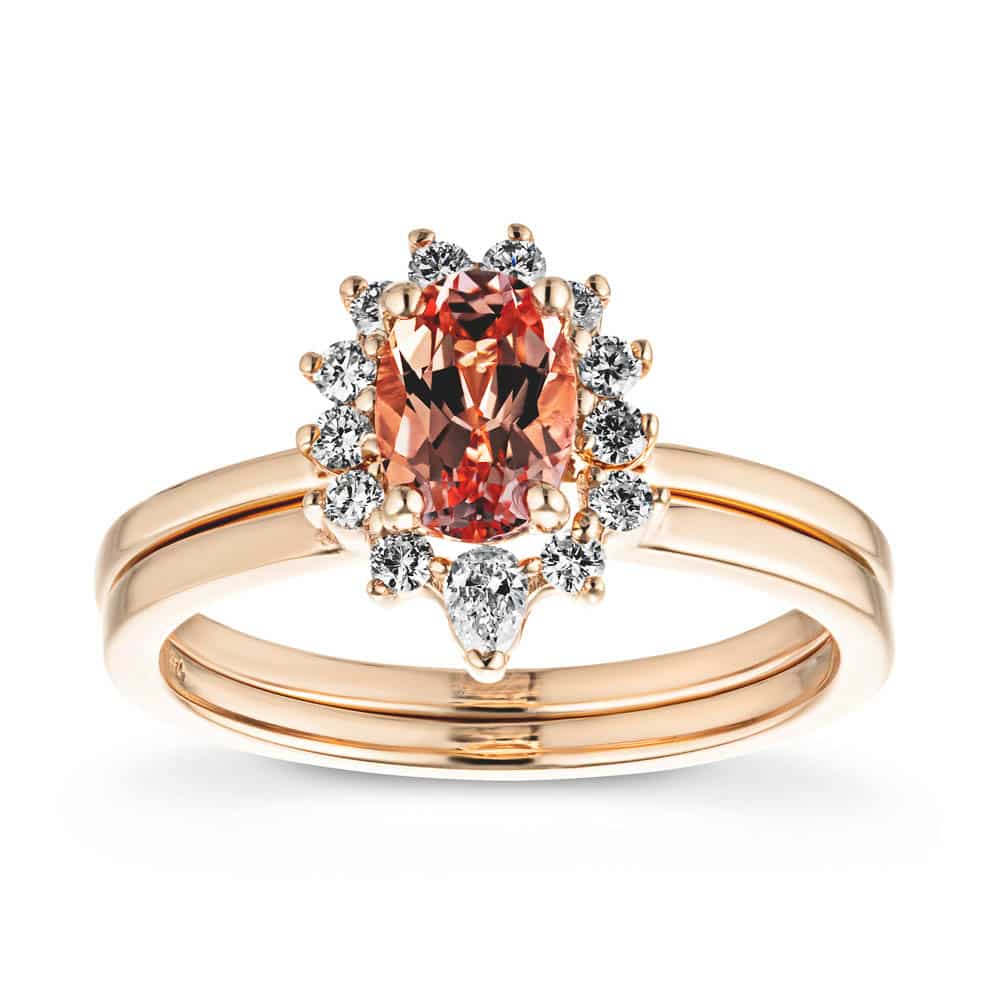 Show with a 1.0ct Oval cut Champagne Sapphire lab created gemstone with a half diamond halo in recycled 14K rose gold and matching wedding band | antique wedding set 1.0ct Oval cut champagne sapphire with a half diamond halo in recycled 14K rose gold
