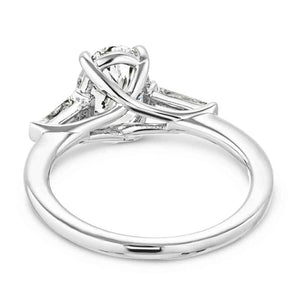 Beautiful three stone engagement ring with trellis set 2ct oval cut lab grown diamond amid baguette side stones in 14k white gold shown from back