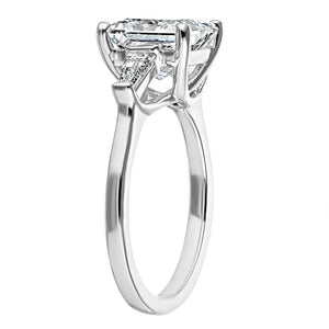 Beautiful three stone engagement ring with trellis set 2.5ct princess cut lab grown diamond amid baguette side stones in 14k white gold shown from side