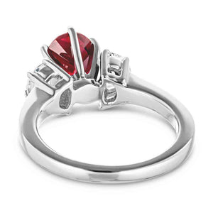 Three stone ruby engagement ring in white gold shown from back
