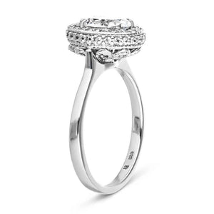 Antique style diamond accented filigree halo engagement ring with 1ct oval cut lab created diamond in 14k white gold shown from side