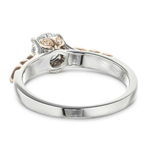 Two tone engagement ring with nature inspired designs holding a 1ct round cut lab diamond in 14k rose and white gold shown from back