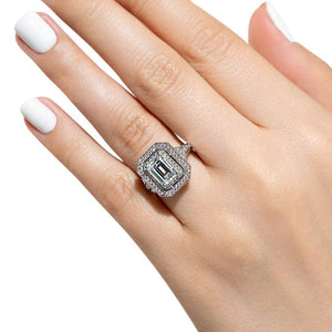 Antique style double halo engagement ring with 1ct emerald cut lab grown diamond in 14k white gold shown worn on hand