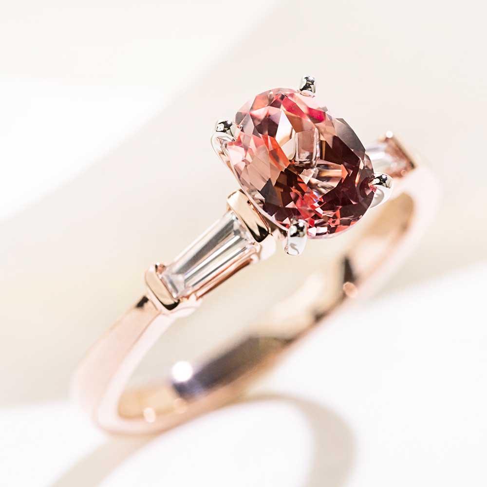 Shown with 1.5ct Oval Cut Lab Grown Champagne Pink Sapphire in 14k Rose Gold