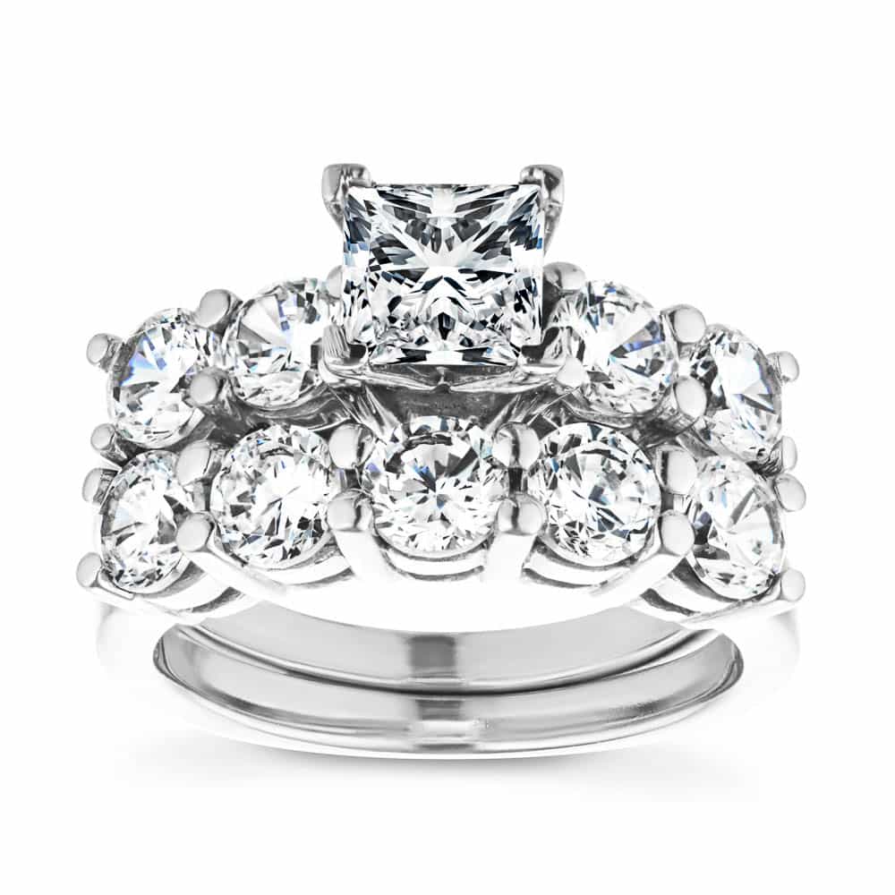 Shown with a 1.0ct Princess cut Lab-Grown Diamond center stone with 1.0ctw Diamond Hybrid side stones in recycled 14K white gold with matching wedding band 