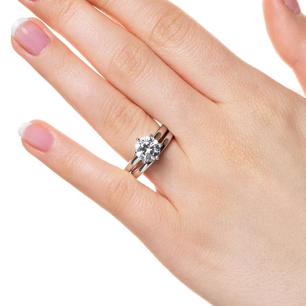 Shown with a 1.84ct Round cut set in a 6-prong head with matching band 