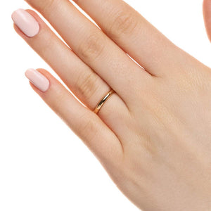  classic wedding band with a 1.5mm width cast in recycled 14K yellow gold