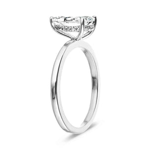 Hidden halo engagement ring with 1ct pear cut lab grown diamond in 14k white gold band shown from side
