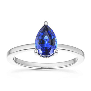 Hidden halo engagement ring with 1ct pear cut lab grown blue sapphire in 14k white gold band