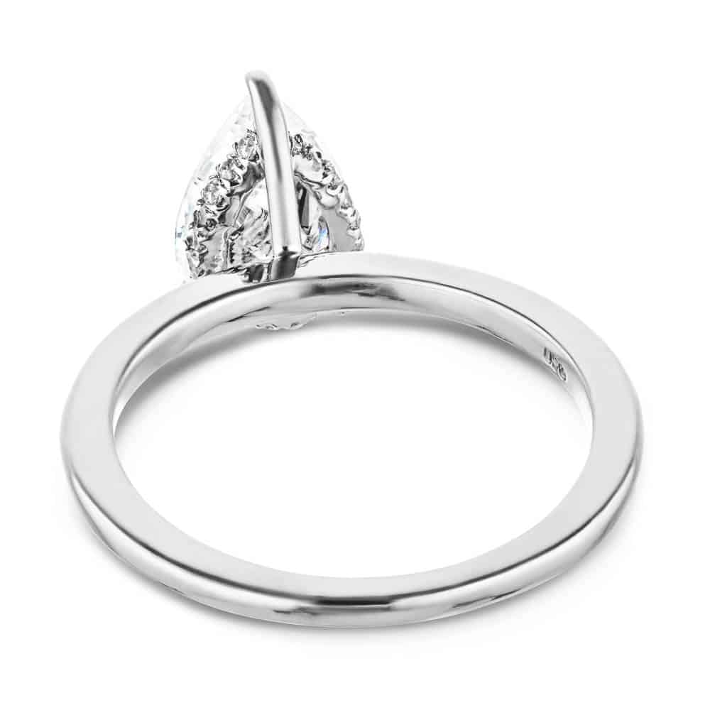 Shown with a 1.0ct Pear cut Lab-Grown Diamond with a hidden halo in recycled 14K white gold with matching wedding band | wedding set hidden halo diamond accented recycled 14k white gold 1.0ct pear cut lab-grown diamond