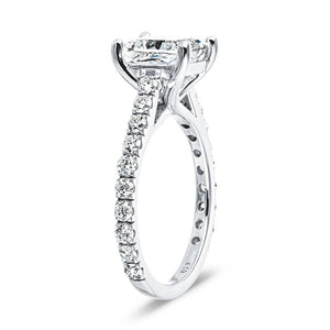 Diamond accented engagement ring with 1ct cushion cut lab grown diamond set in a four prong trellis in platinum shown from side