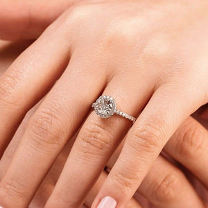 Diamond accented halo engagement ring with 2ct round cut lab grown diamond in 14k white gold on hand