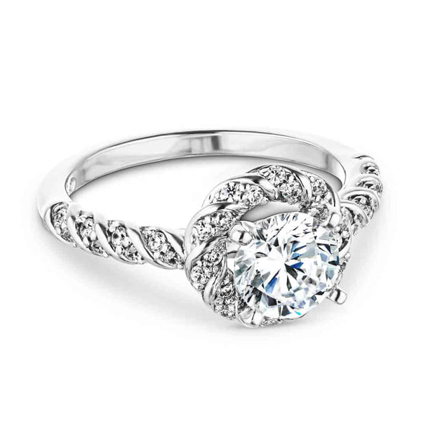 Shown with 1ct Round Cut Lab Grown Diamond in 14k White Gold|Unique twisted diamond halo engagement ring with a 1ct round cut lab grown diamond in a braided design 14k white gold metal band