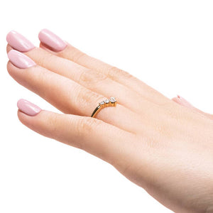 Diamond V shaped wedding band with graduated accenting recycled diamond in 14k yellow gold