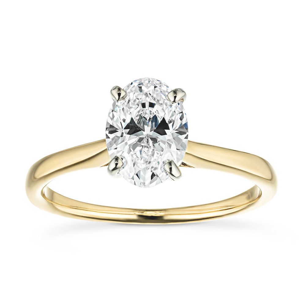 Set with a 2.5ct oval cut lab grown diamond in 14k yellow gold
