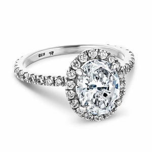 Dream diamond halo engagement ring with diamond accents and a 1ct oval cut lab grown diamond in platinum