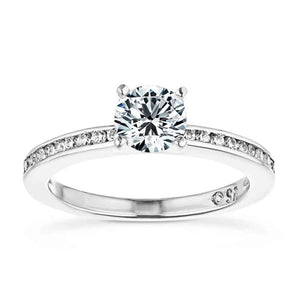 Ethical diamond accented engagement ring with channel set diamonds and a 1ct round cut lab grown diamond set in 14k white gold