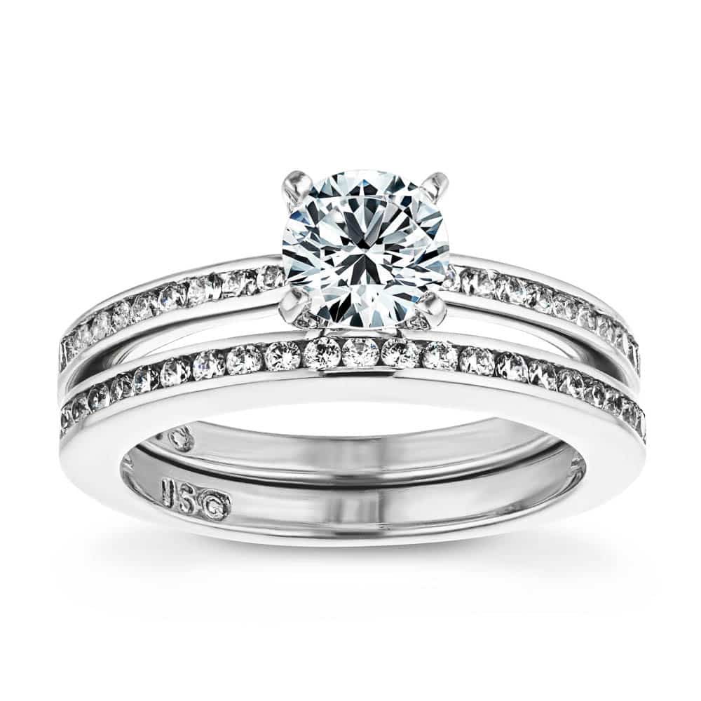 Shown with a 1.0ct Round cut Lab-Grown Diamond with channel set accenting diamonds in recycled 14K white gold with matching wedding band | wedding set Shown with a 1.0ct Round cut Lab-Grown Diamond with channel set accenting diamonds in recycled 14K white gold with matching wedding band