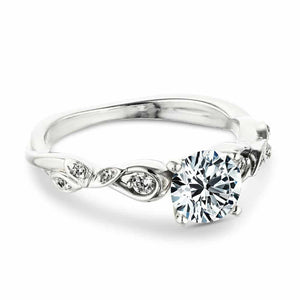 Nature inspired engagement ring with diamond accenting and a 1ct round cut lab grown diamond in 14k white gold