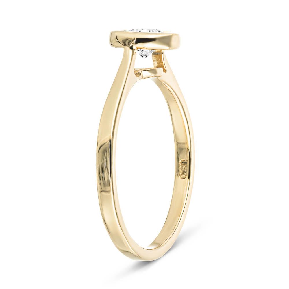 Shown with 1ct Round Cut Lab Grown Diamond in 14k Yellow Gold|Modern minimalistic engagement ring with 1ct round cut bezel set lab grown diamond in 14k yellow gold