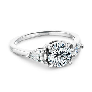Three stone engagement ring with 1ct round cut lab grown diamond center and 0.5ct pear cut diamond side stones in 14k white gold