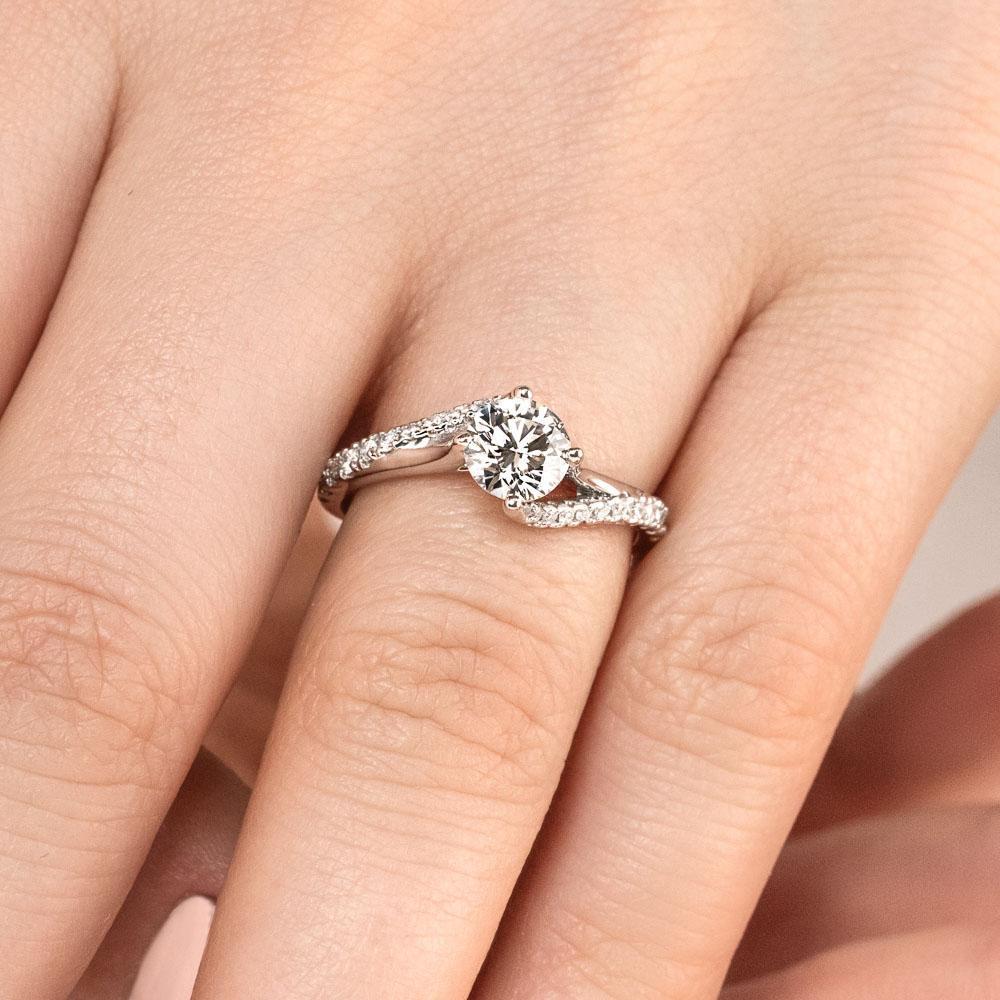 Shown with 1ct Round Cut Lab Grown Diamond in 14k White Gold|Modern engagement ring with twisted diamond accented band set with 1ct round cut lab grown diamond in 14k white gold
