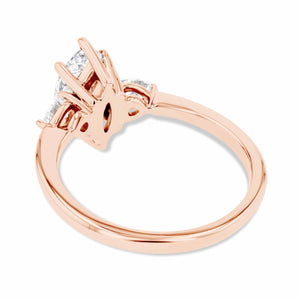 three stone engagement ring with marquise shape lab grown diamond center stone in 14k rose gold 