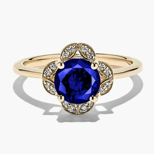 diamond accented halo engagement ring with Blue Sapphire lab created gemstone in 14k yellow gold