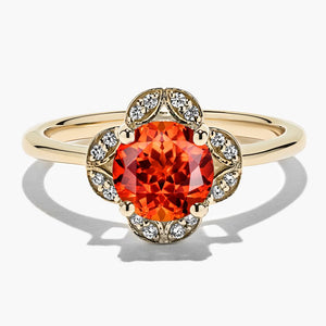 diamond accented halo engagement ring with Padparadscha lab created gemstone in 14k yellow gold