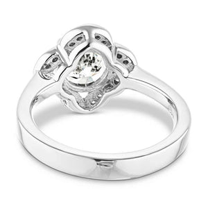 Nature inspired vintage style engagement ring with floral petal halo design around a 1ct round cut lab diamond in 14k white gold