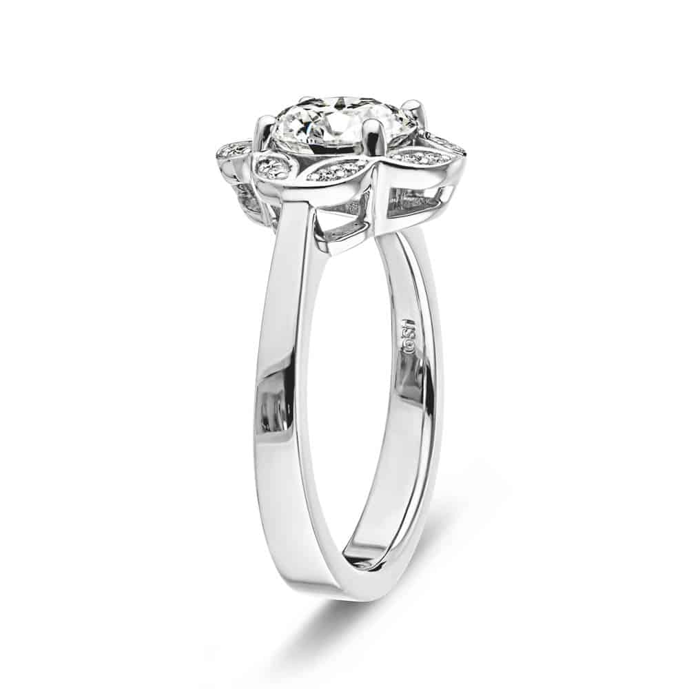 Shown with 1ct round cut lab grown diamond in 14k white gold|Nature inspired vintage style engagement ring with floral petal halo design around a 1ct round cut lab diamond in 14k white gold