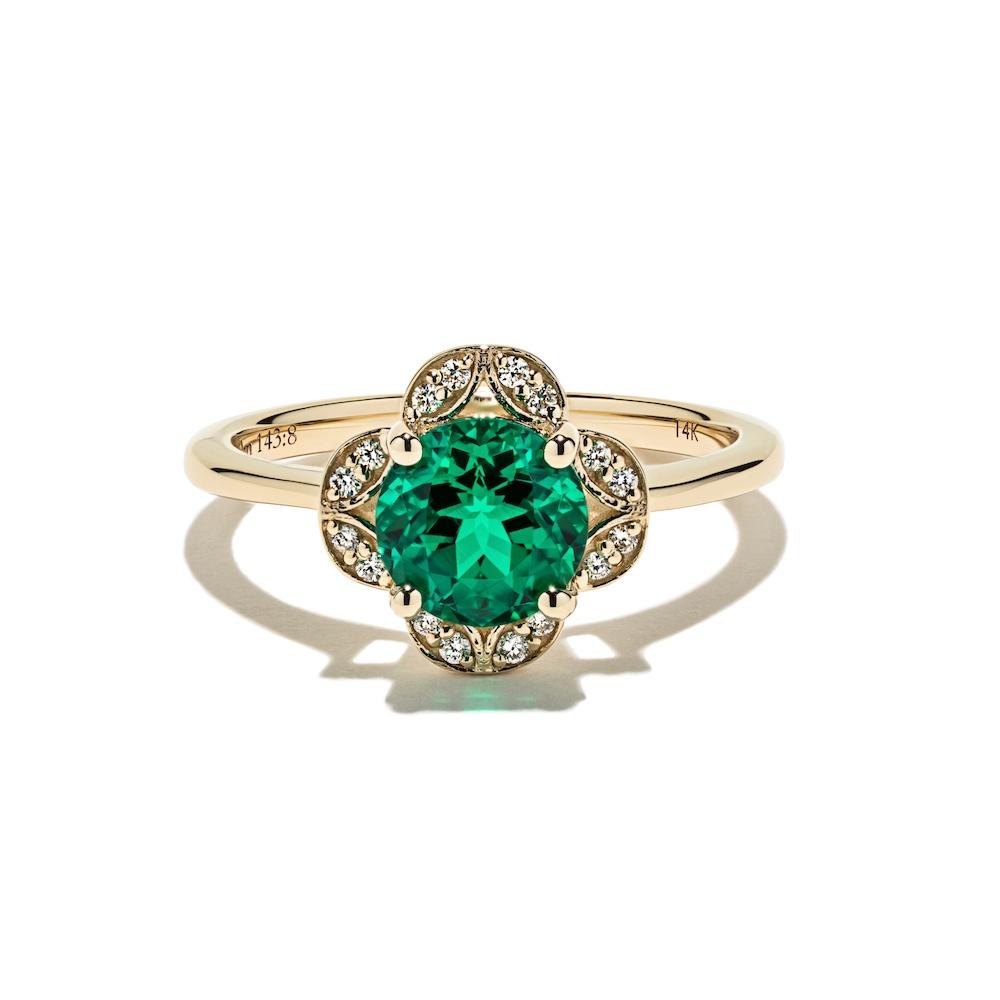 Grace Vintage Engagement Ring shown with a 1.0ct round cut Emerald Lab-Created Gemstone with a petal diamond halo in recycled 14K yellow gold 