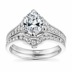  antique vintage engagement ring Shown with a 1.0ct Oval cut Lab-Grown Diamond with filigree detail and accenting diamonds on the band in recycled 14K white gold with matching band