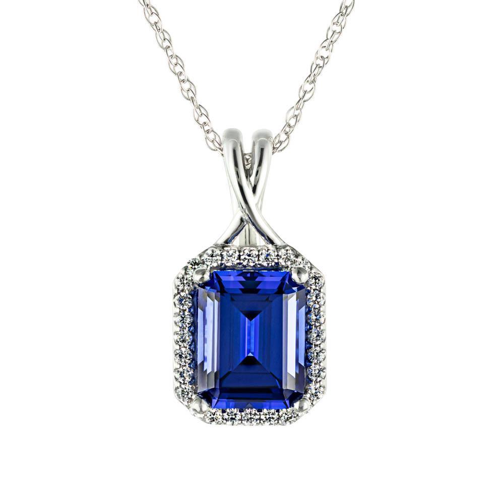 Set with a 3ct emerald shape lab-grown blue sapphire 