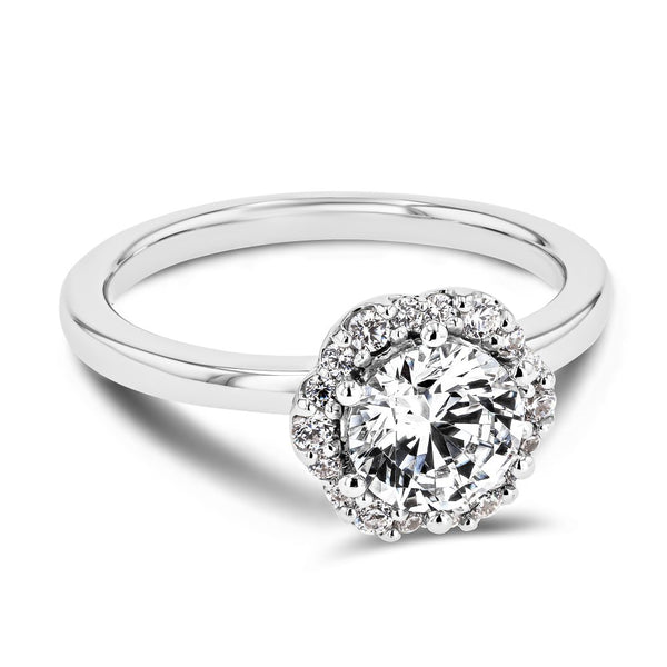 Shown here with a 1.0ct Round Cut Lab Grown Diamond center stone in 14K White Gold|diamond halo engagement ring with round cut lab grown diamond center stone set in 14k white gold metal