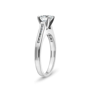 Contemporary channel set diamond accented engagement ring with 1ct round cut lab grown diamond  set in platinum