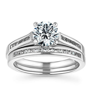 wedding set Shown with a 1.0ct Round cut Lab Grown Diamond with channel set diamond accented band with matching wedding band in recycled 14K white gold