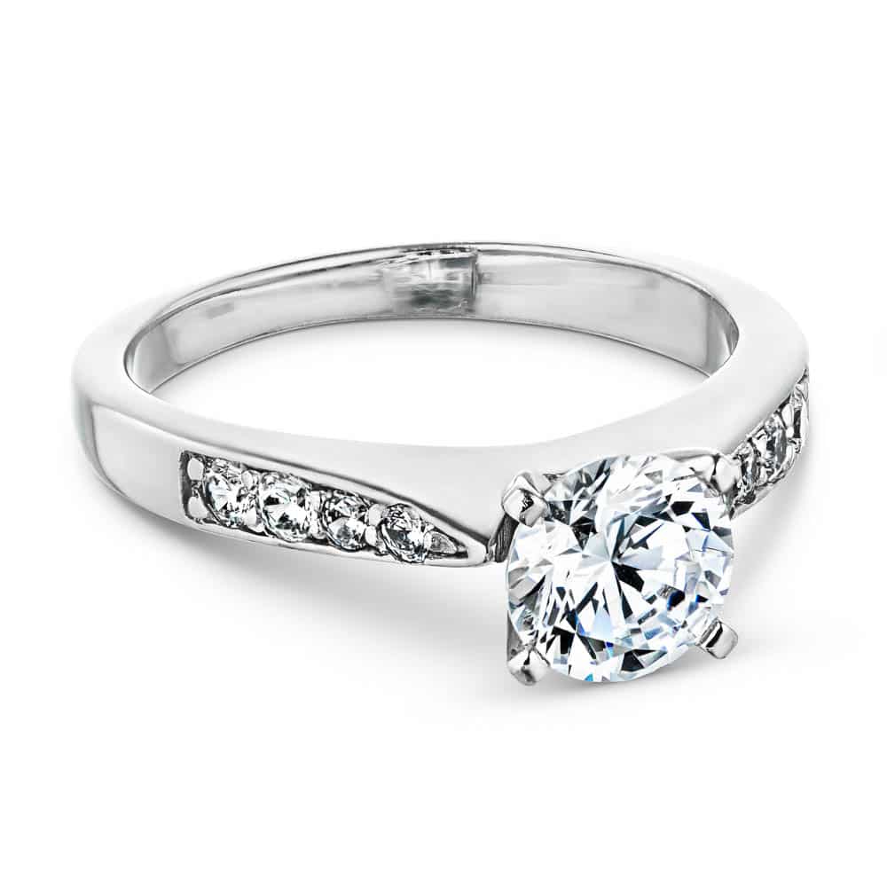 Shown with 1ct Round Cut Lab Grown Diamond in 14k White Gold|Modern style solitaire engagement ring with a 1ct round cut lab grown diamond and channel set accenting diamonds in 14k white gold