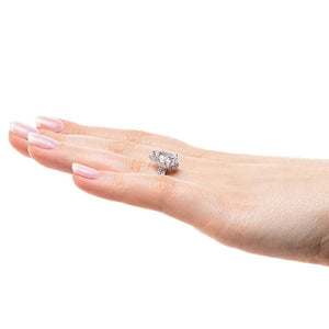  halo diamond accented engagement ring Shown with a 1.91ct Pear cut Lab-Grown Diamond with a diamond accented halo and band in recycled 14K white gold with matching wedding band