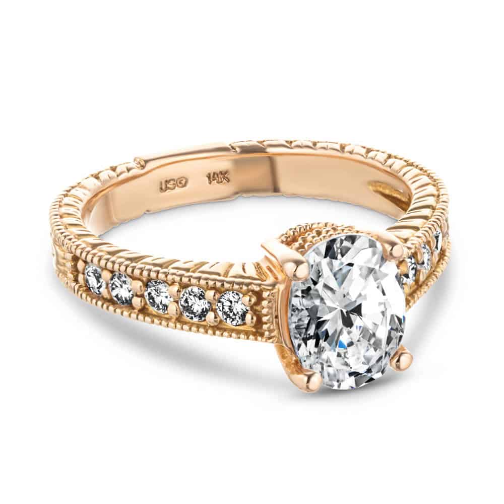 Shown with 1ct Oval Cut Lab Grown Diamond in 14k Rose Gold|Beautiful antique style diamond accented engagement ring with milgrain and filigree detailing around a 1ct oval cut lab diamond in 14k rose gold