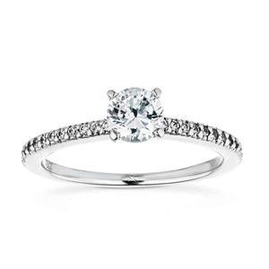 Ethical diamond accented solitaire engagement ring with 4 prong set round cut lab grown diamond in 14k white gold