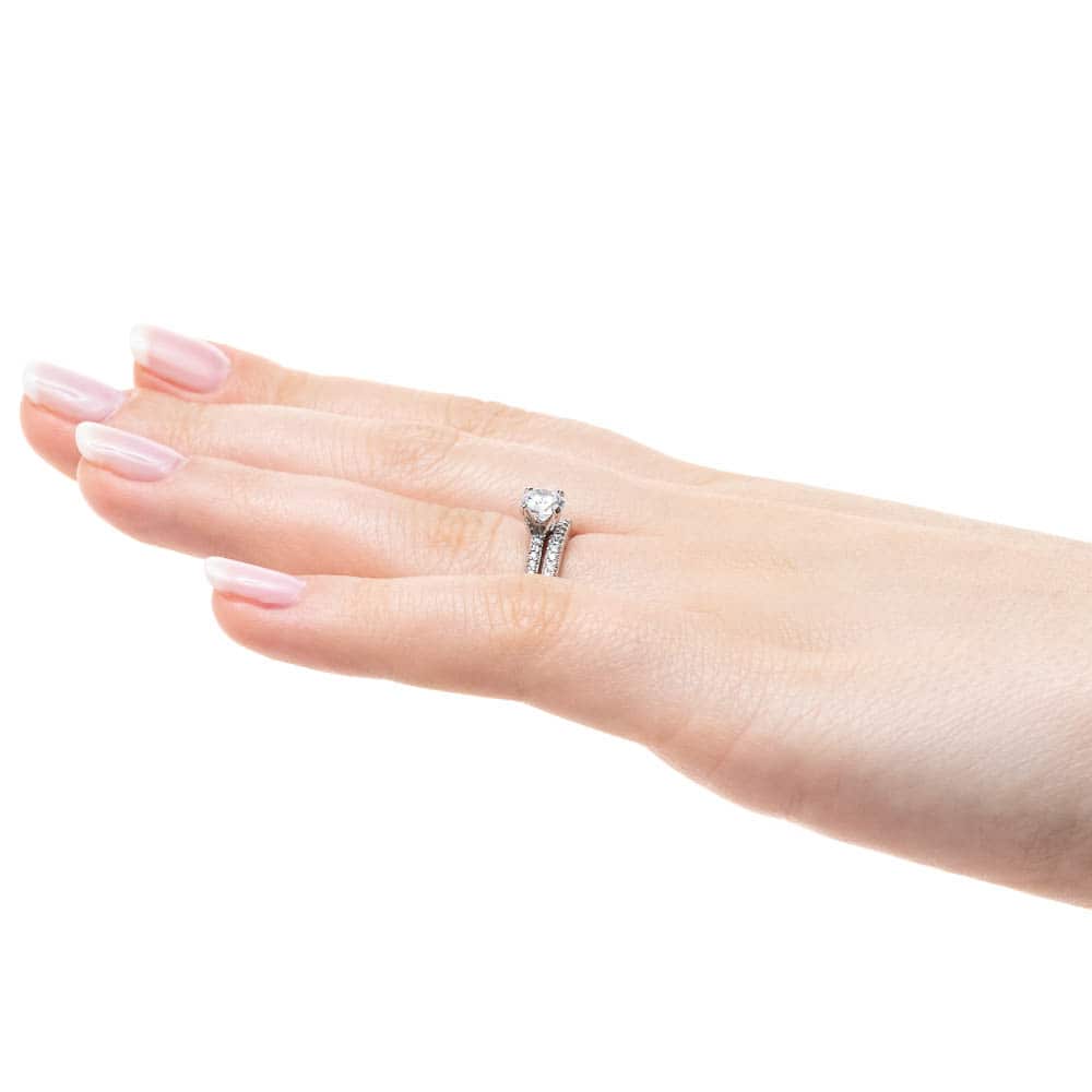 Shown with a 1.0ct Round cut Lab-Grown Diamond with a diamond accented band in recycled 14K white gold with matching wedding band 