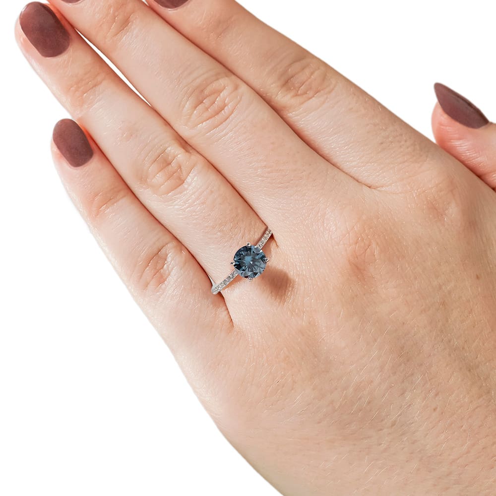 Shown with 1ct Round Cut Blue Moissanite in 14k White Gold